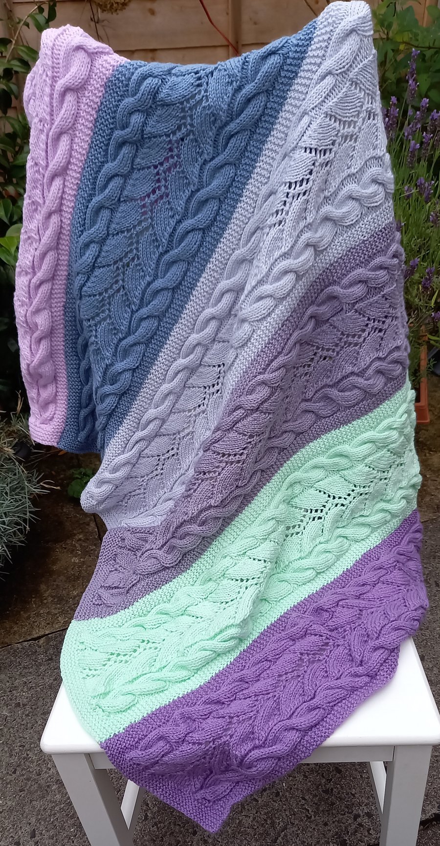 Hand knitted  blanket with cables 