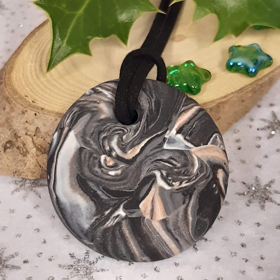 Black, silver and sienna round pendant