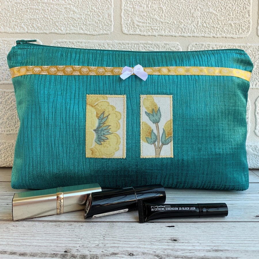 Large turquoise make up bag with golden yellow floral panels