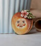 Peach brooch featuring peachy Pete - Image 1