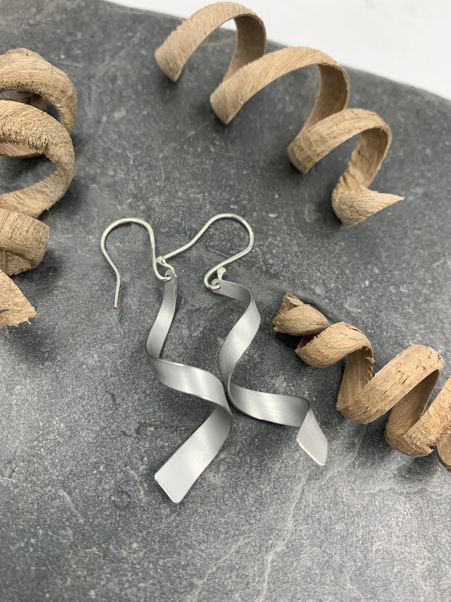 spiral dangly earrings in silver aluminium