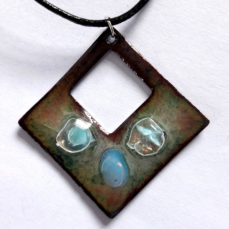 Pierced square pendant embellished with three beads 