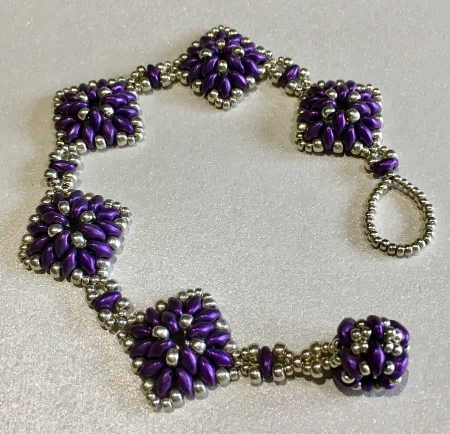 Purple and silver diamond bead bracelet