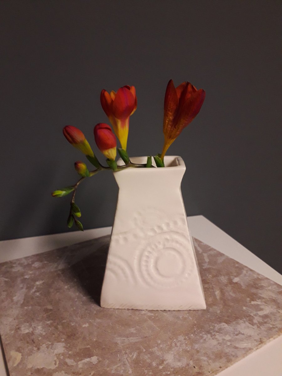 Ceramic handbuilt bud vase with impressed vintage lace pattern.