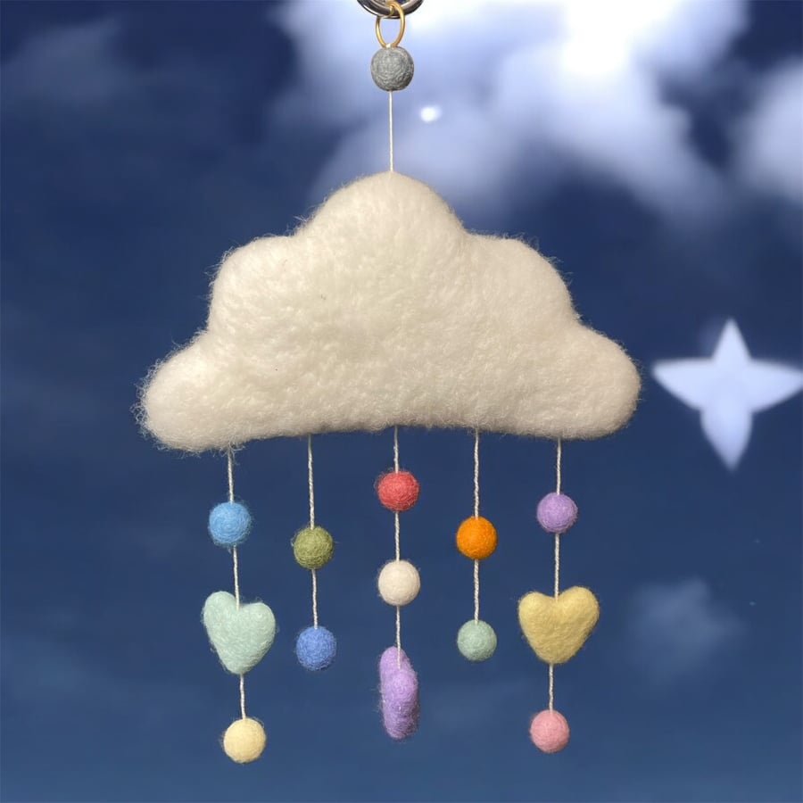 Felted cloud mobile with pastel coloured felt balls and hearts, nursery decor
