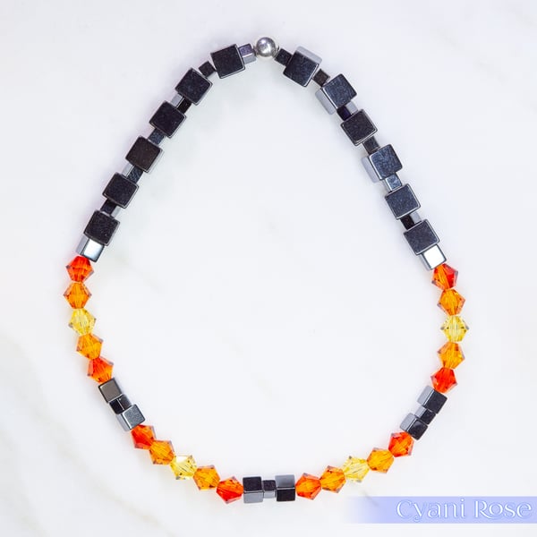 Bracelet handmade with Swarovski and Hematite beads stretchy black and orange