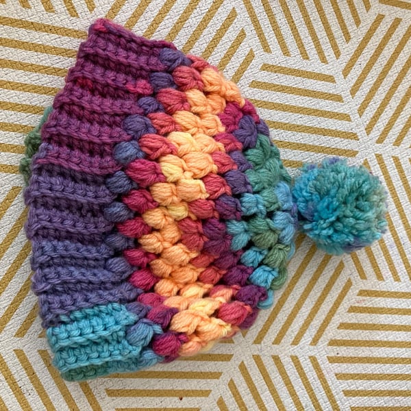 Colourful cosy rainbow Pom Pom bobble hat 