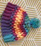 Colourful cosy rainbow Pom Pom bobble hat 
