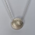 Medium size, sterling silver domed pendant 