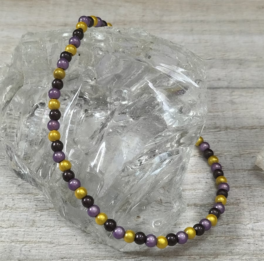 AL54 Purple and yellow miracle bead anklet