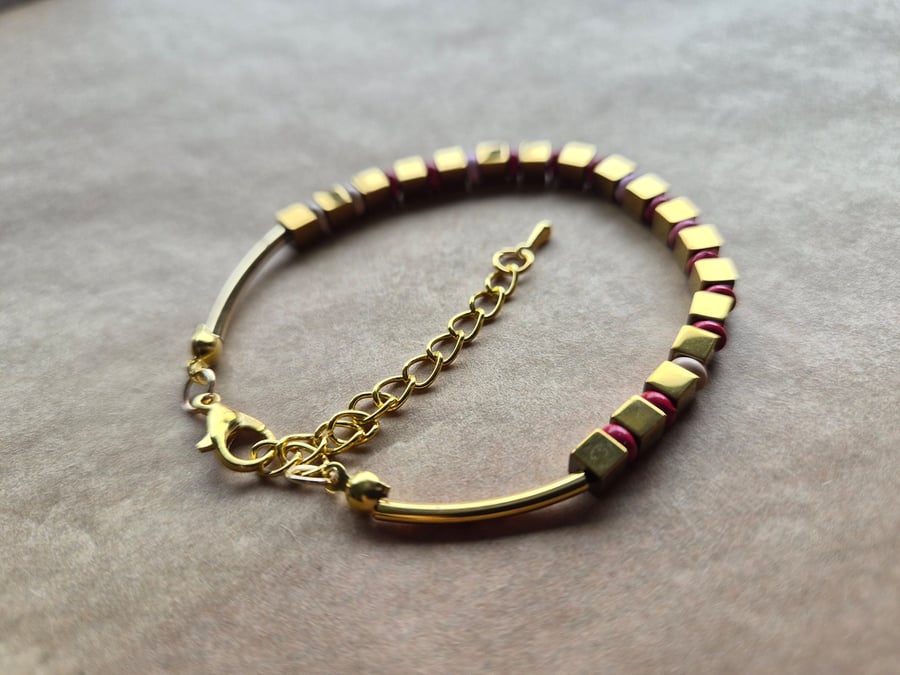 Red, gold and pink mix, playful holiday bracelet. 