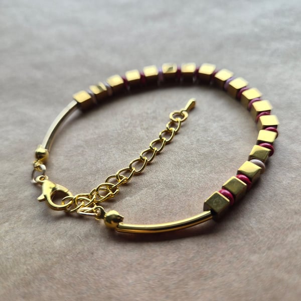 Red, gold and pink mix, playful holiday bracelet. 