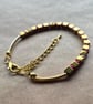 Red, gold and pink mix, playful holiday bracelet. 