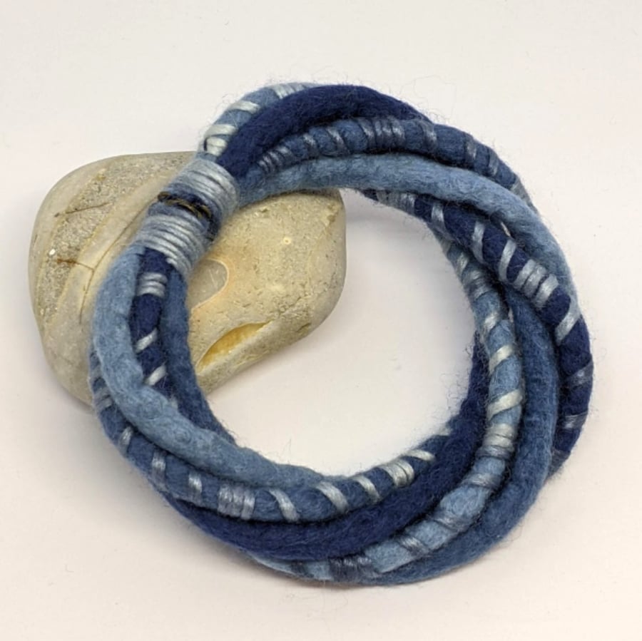 Felted cord bracelet in shades of denim blues