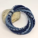 Felted cord bracelet in shades of denim blues