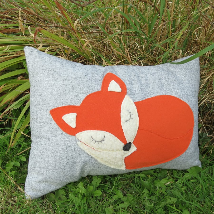 A snoozy fox cushion, complete with inner pad.  43cm x 32cm.