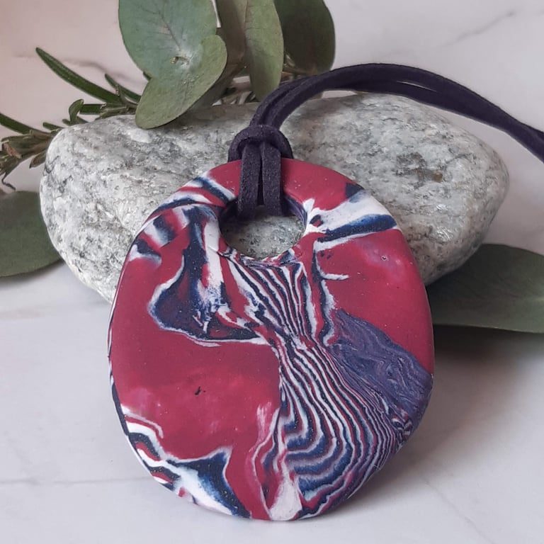 Pendant in a burgundy, navy and white swirl design