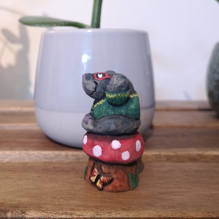 Hand carved, painted and finished wooden Mr. Montague Mole on a toadstool