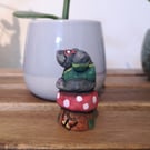 Hand carved, painted and finished wooden Mr. Montague Mole on a toadstool