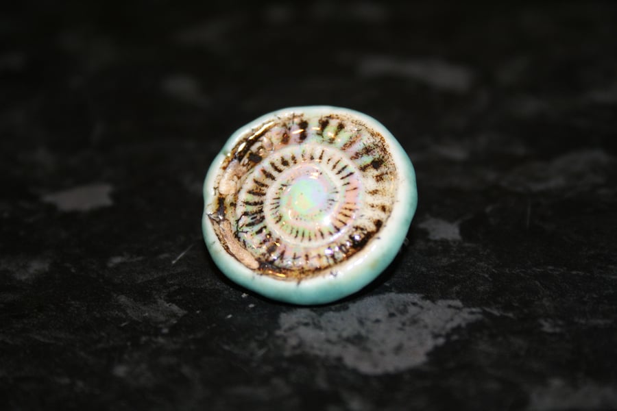 Handmade ceramic light green & mother of pearl lustre ammonite brooch