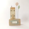 Wooden house with clay flower garden 'home'