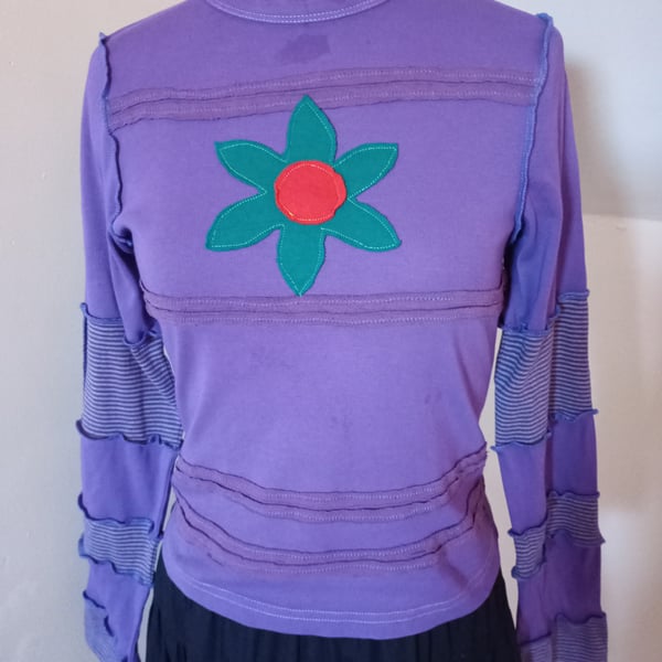 Patchwork top with long sleeves and flower applique
