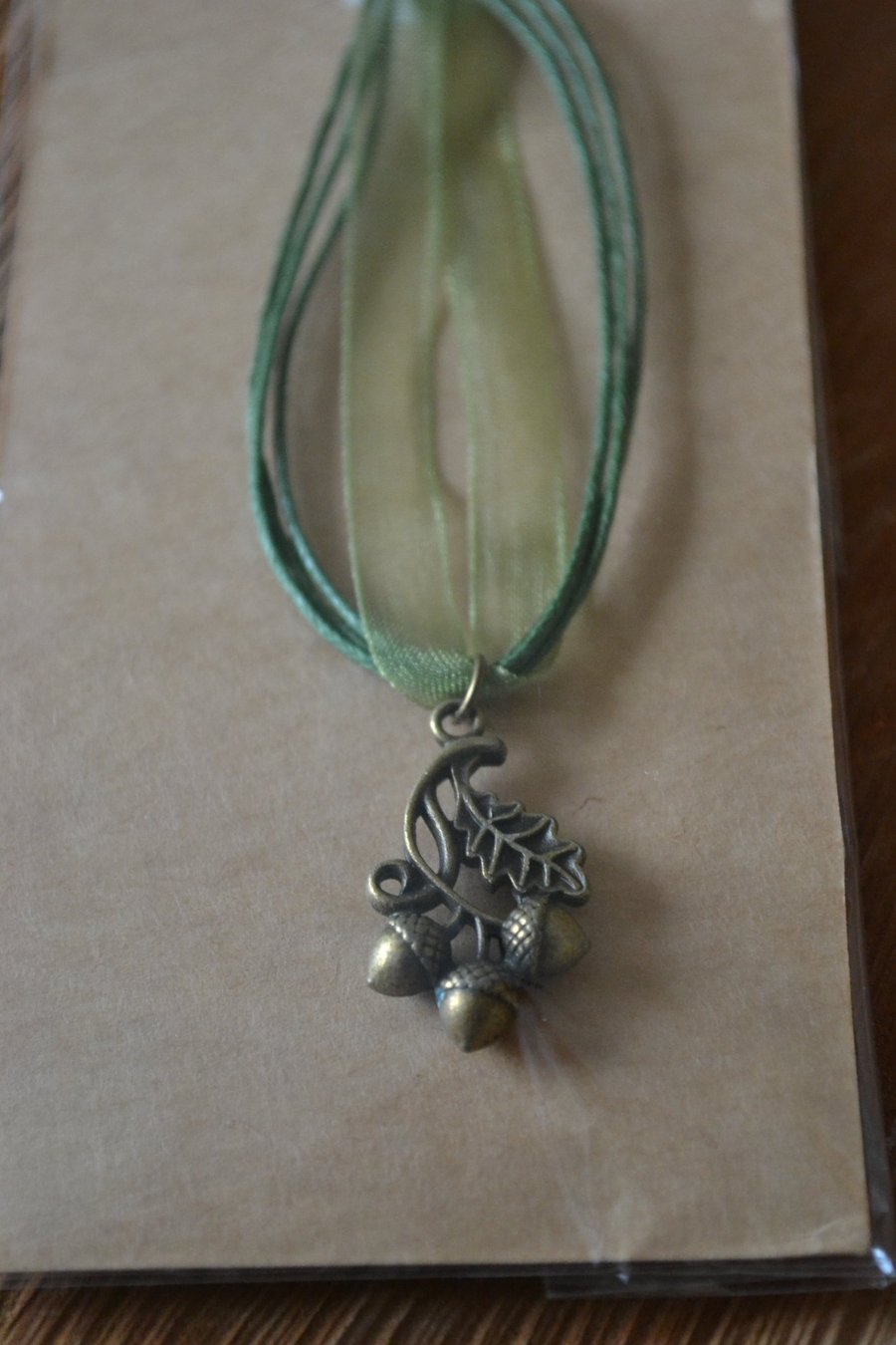 Acorn necklace on green chord