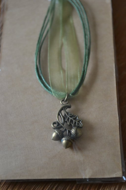 Acorn necklace on green chord
