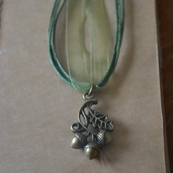 Acorn necklace on green chord