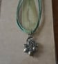 Acorn necklace on green chord