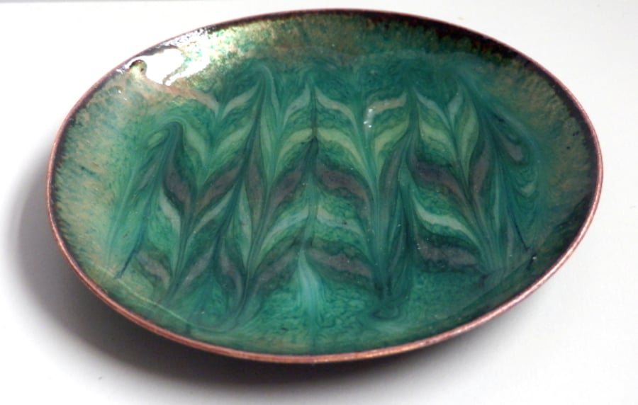 enamelled dish: scrolled pale yellow and pale brown on green over clear