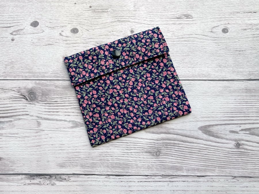 Discreet sanitary pouch. Feminine products holder. Ditsy navy blue and pink.