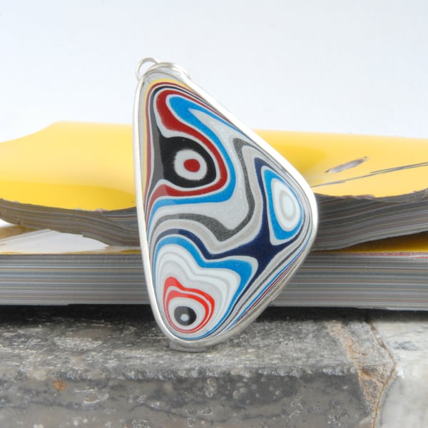 Swirly shimmery Ford fordite pendant