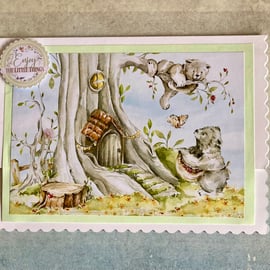 Card. A storybook card of bears in the woods.