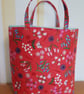 Reusable fabric gift bag: bluebells & lily of the valley on red background 