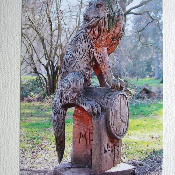 Photographic greetings card of "Mr. Wolf" in chain-saw art.