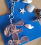 Shells in resin initial keyring letter  E