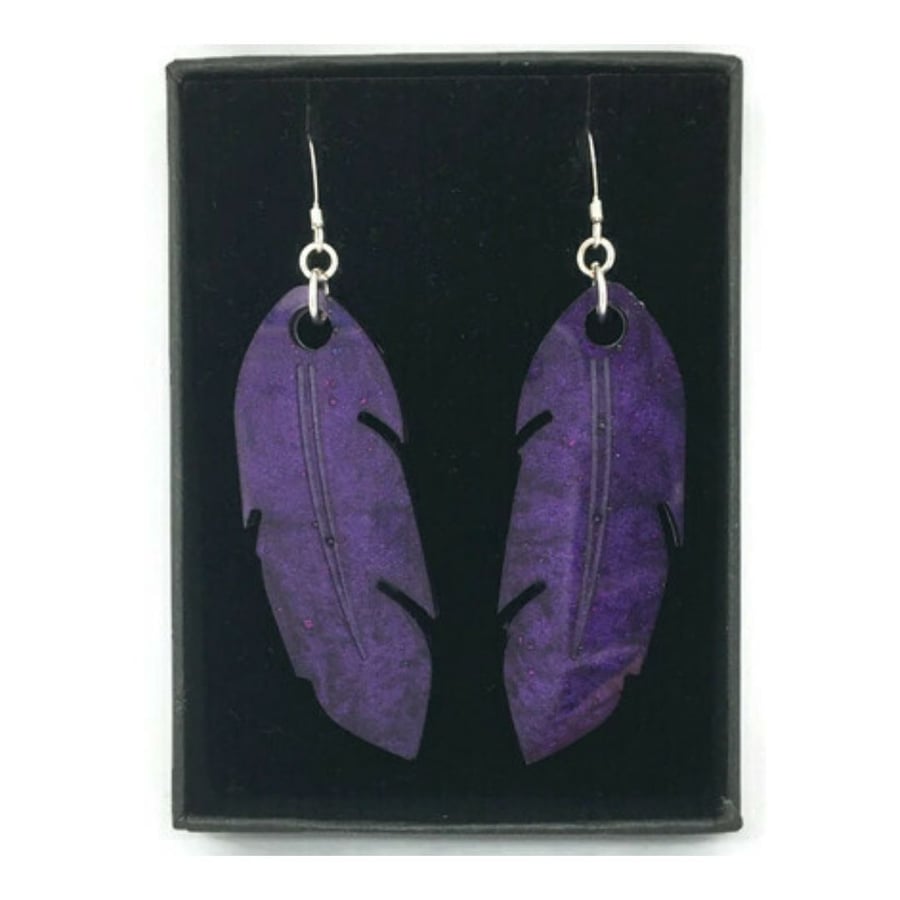 Purple shimmer feather earrings on sterling silver ear wires.