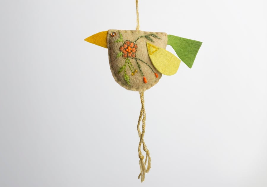 Hay coloured hand embroidered bird-shaped hanging decoration called Big Chixy