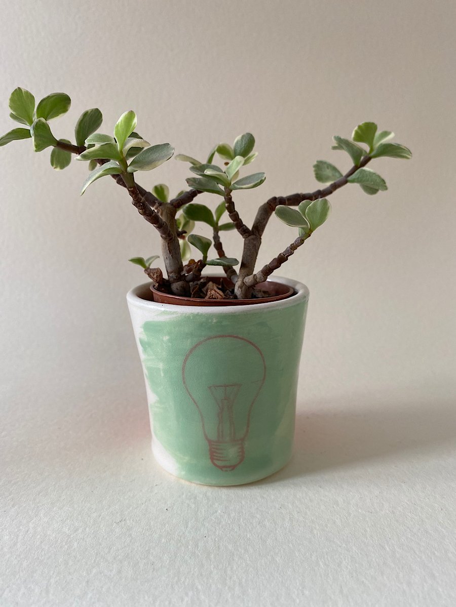 Lightbulb ceramic tea light tub.