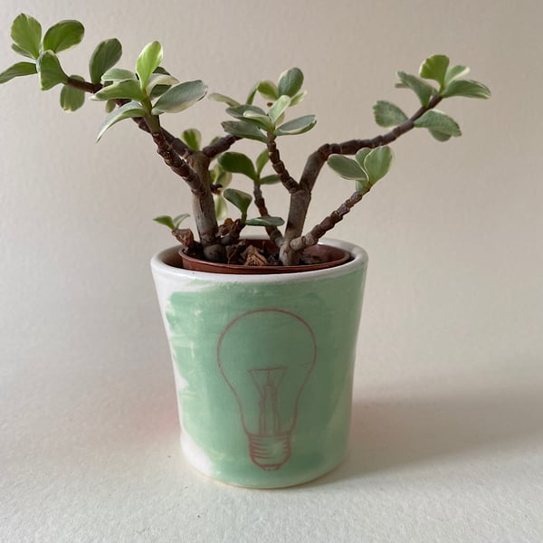 Lightbulb ceramic tea light tub.