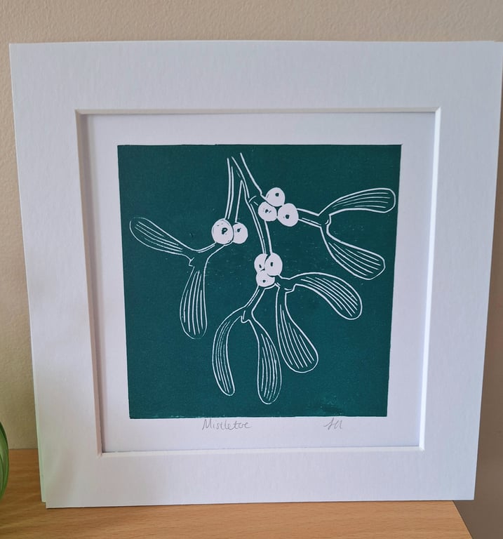 An original handprinted linoprint of a sprig of mistletoe 