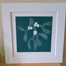 An original handprinted linoprint of a sprig of mistletoe 