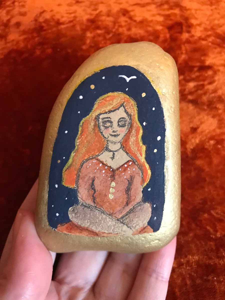 Painted pebble, meditating woman
