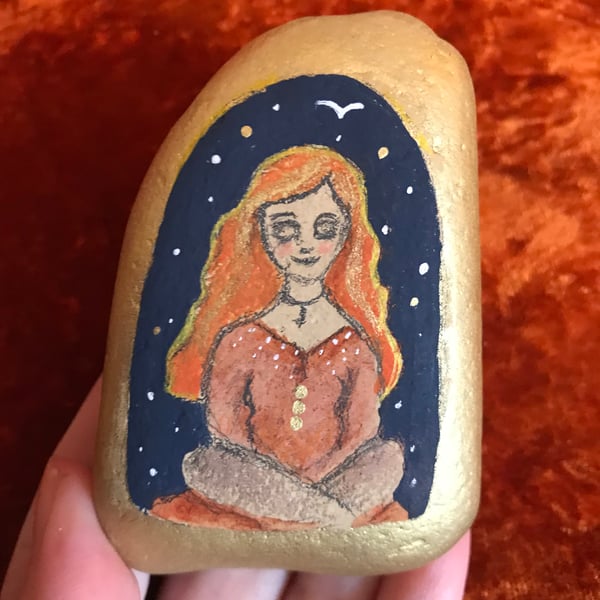 Painted pebble, meditating woman