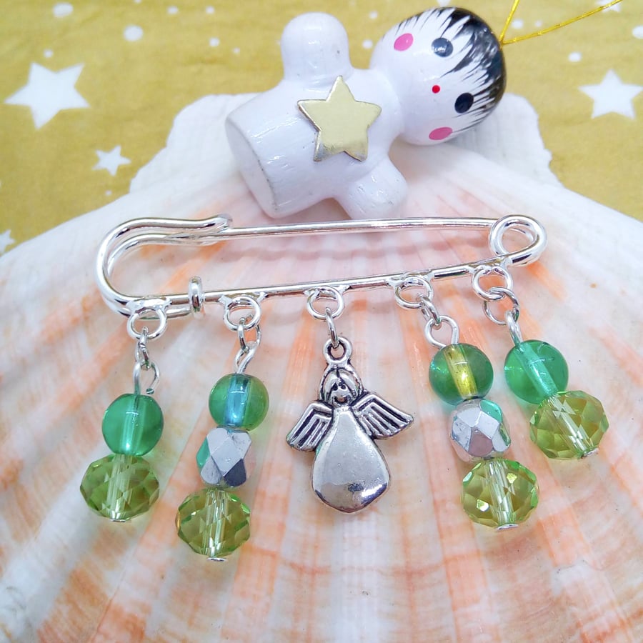 Green Beaded Charms and a Silver Angel Charm on a Silver Kilt Pin Base, Brooch