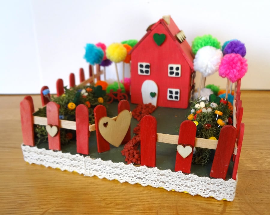 Pink house in colourful garden