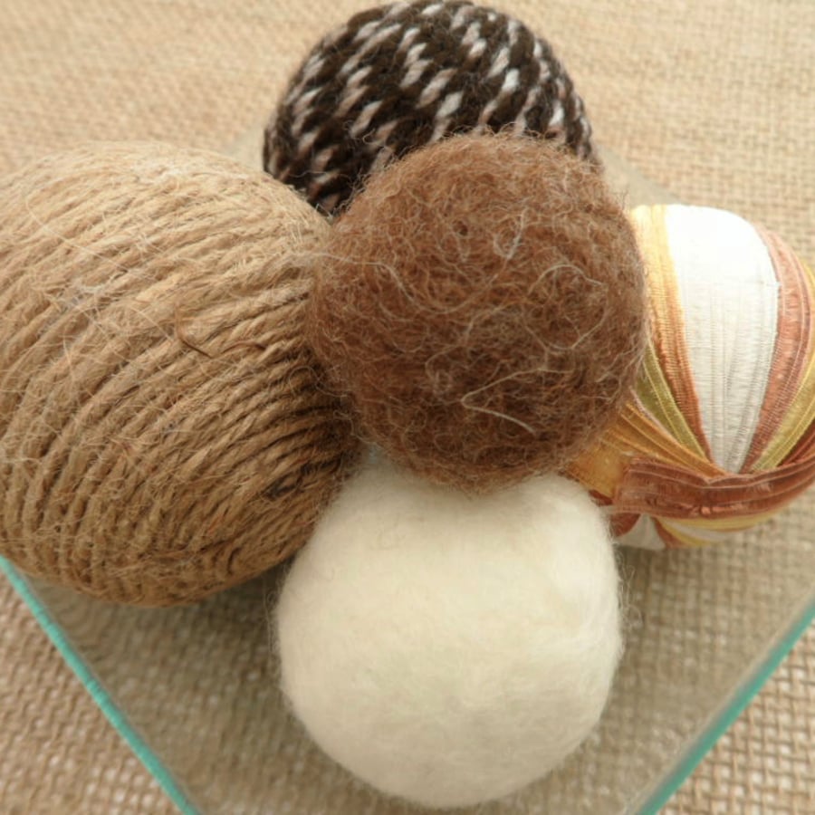 Decorative balls on glass plate (browns)