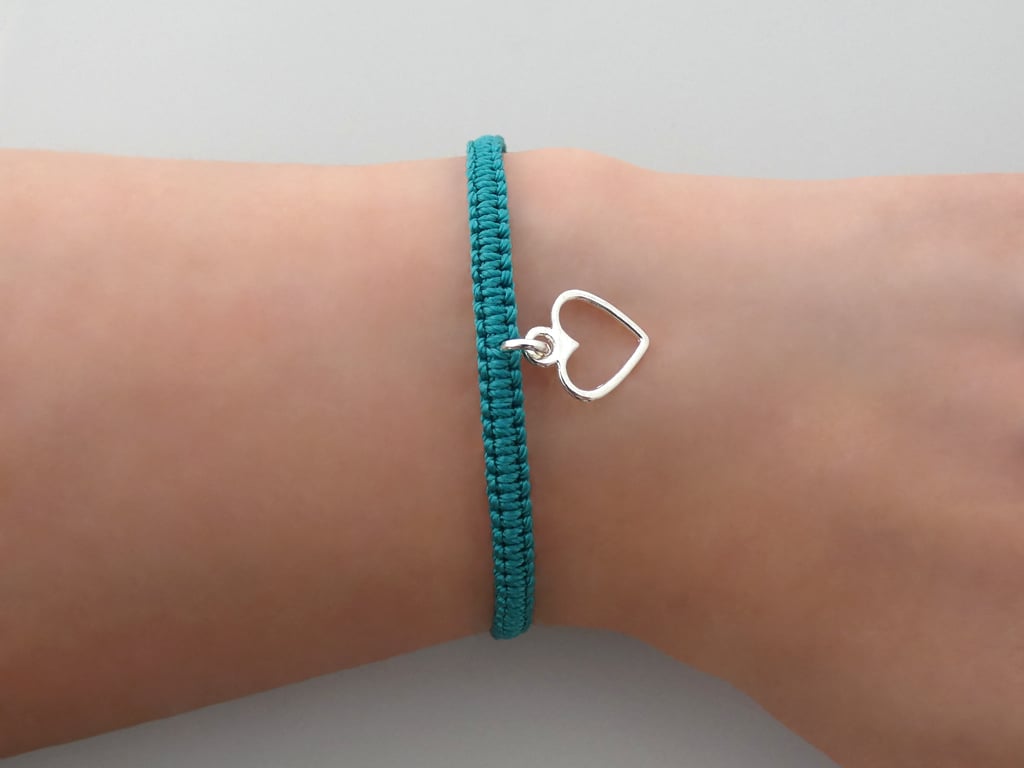 Silver plated macramé heart bracelet with 7 colour options. Ref:434
