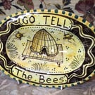 Oval slip ware dish with hand painted bee skep